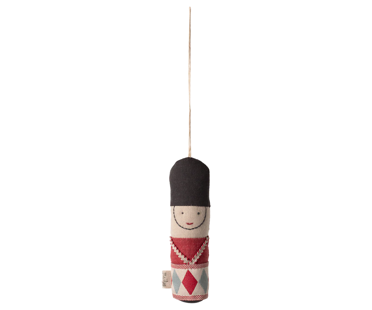 Decorative hanging figure with black hat and red diamond pattern on a white background | mAILEG uk
