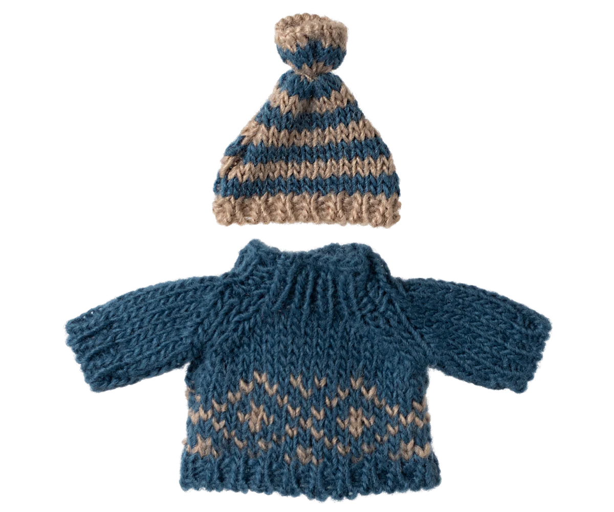 Knitted blue and brown sweater with matching hat on a white background