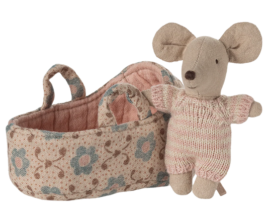 Knitted mouse toy with floral-patterned basket on a white background