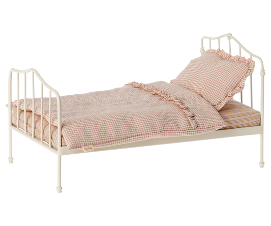 A miniature vintage-style bed in with a checkered pink and white bedsheet, and a single pillow. | Maileg UK | Vintage bed, Miniature - Purple