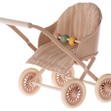 A toy stroller for mouse figures with a striped beige and pink seat, metal frame, and four plastic wheels. | Maileg UK