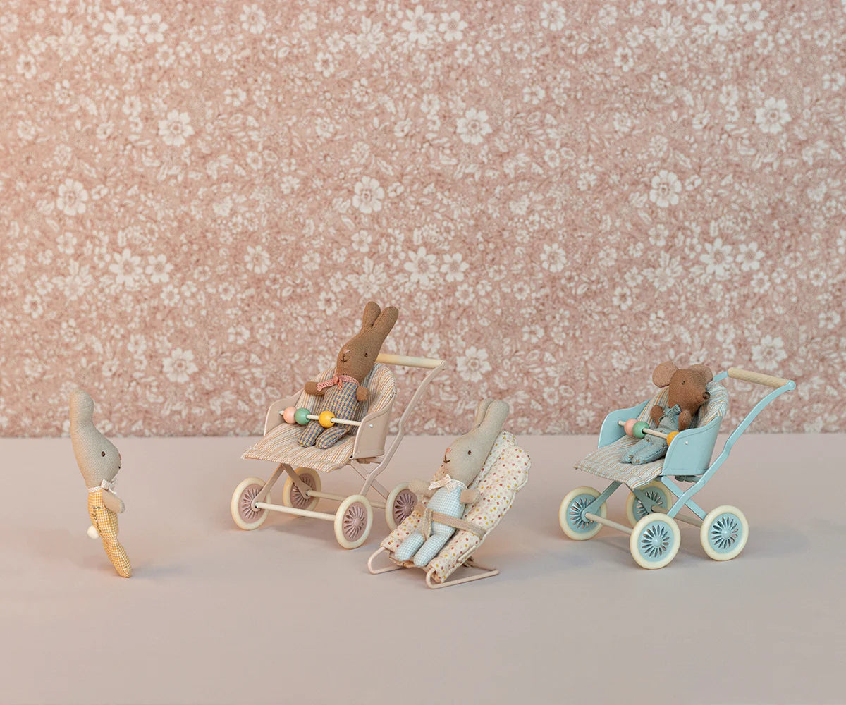 Small toy figures with strollers against a floral-patterned background | Maileg UK