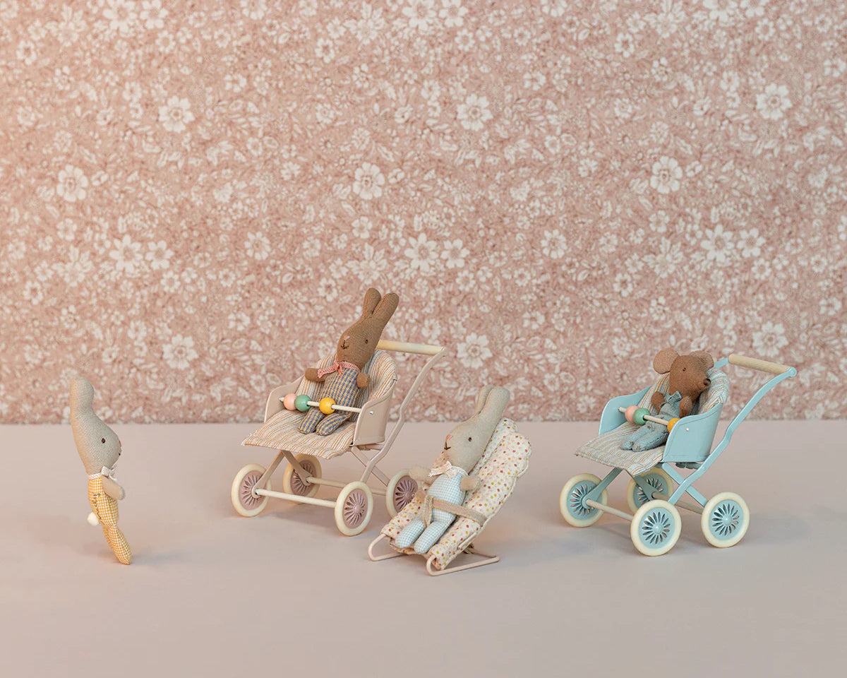 Small toy figures with strollers against a floral-patterned background | Maileg UK