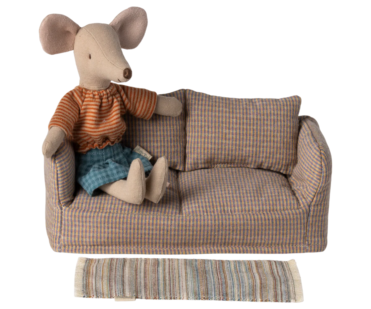 Stuffed mouse toy in a plaid sofa with a striped blanket on a white background | Maileg uk