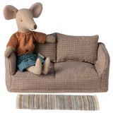 Stuffed mouse toy in a plaid sofa with a striped blanket on a white background | Maileg uk