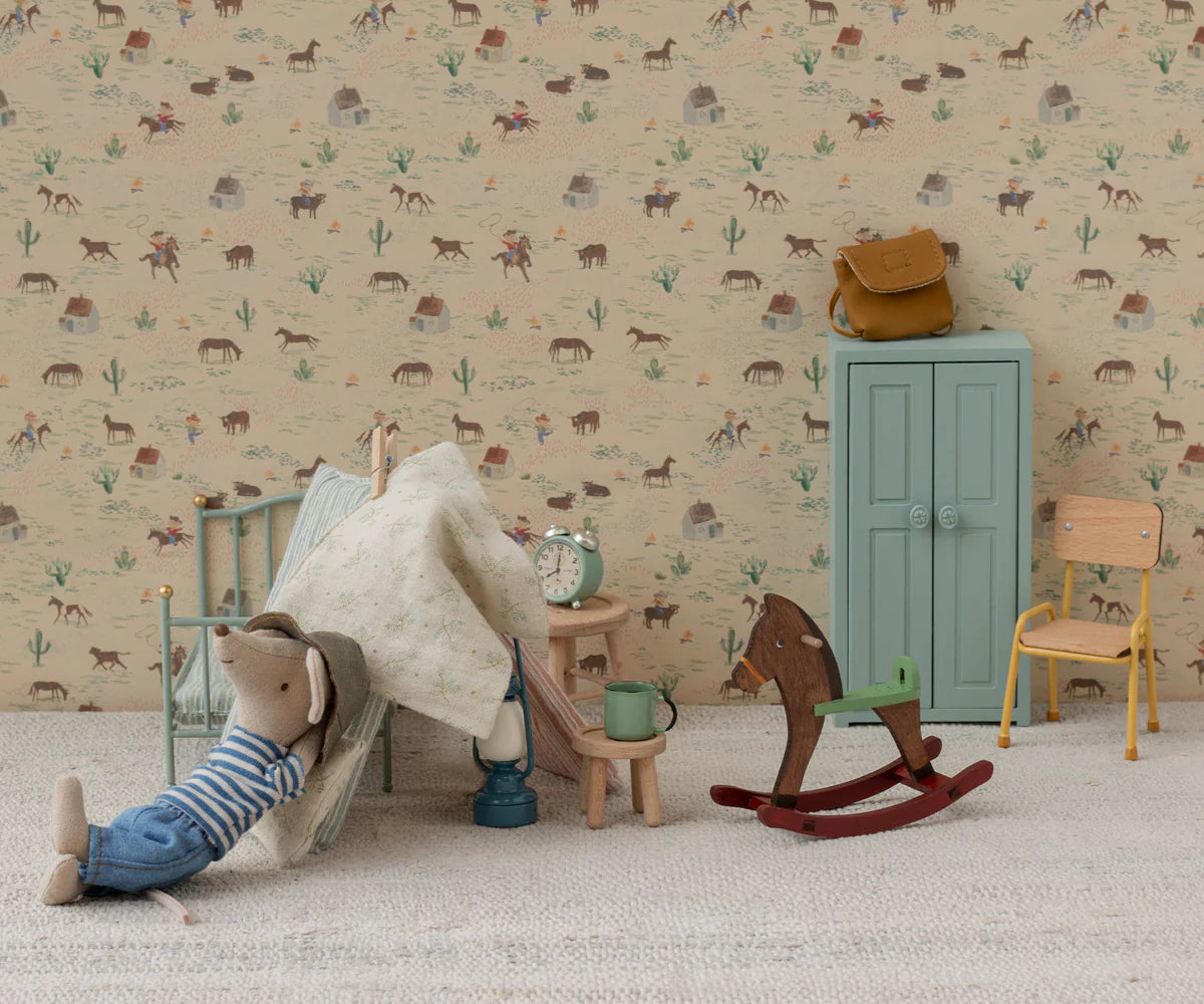 Children's room with toys and furniture against a patterned wall. | Maileg UK