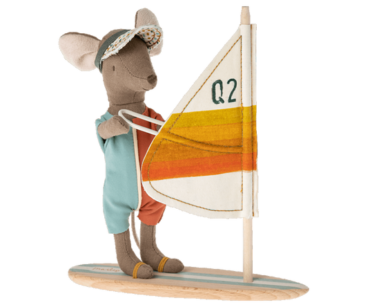 Maileg Surfer Beach mouse on his wakeboard with orange stripes on the sail and a wooden board with blue stripes. His hands are magnetic to hold on to the sail.