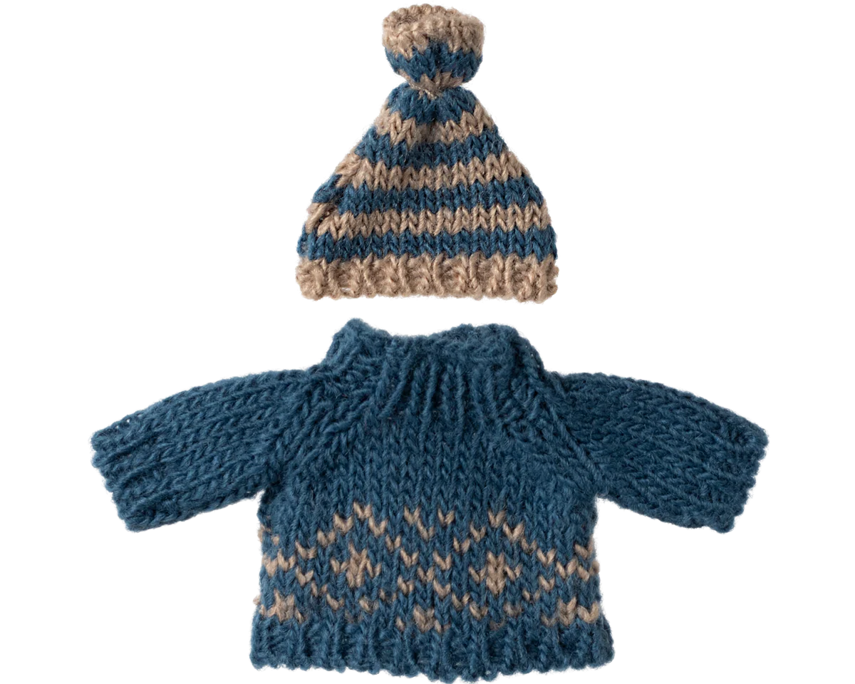 Knitted blue and brown sweater with matching hat on a white background