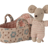 Knitted mouse toy with floral-patterned basket on a white background