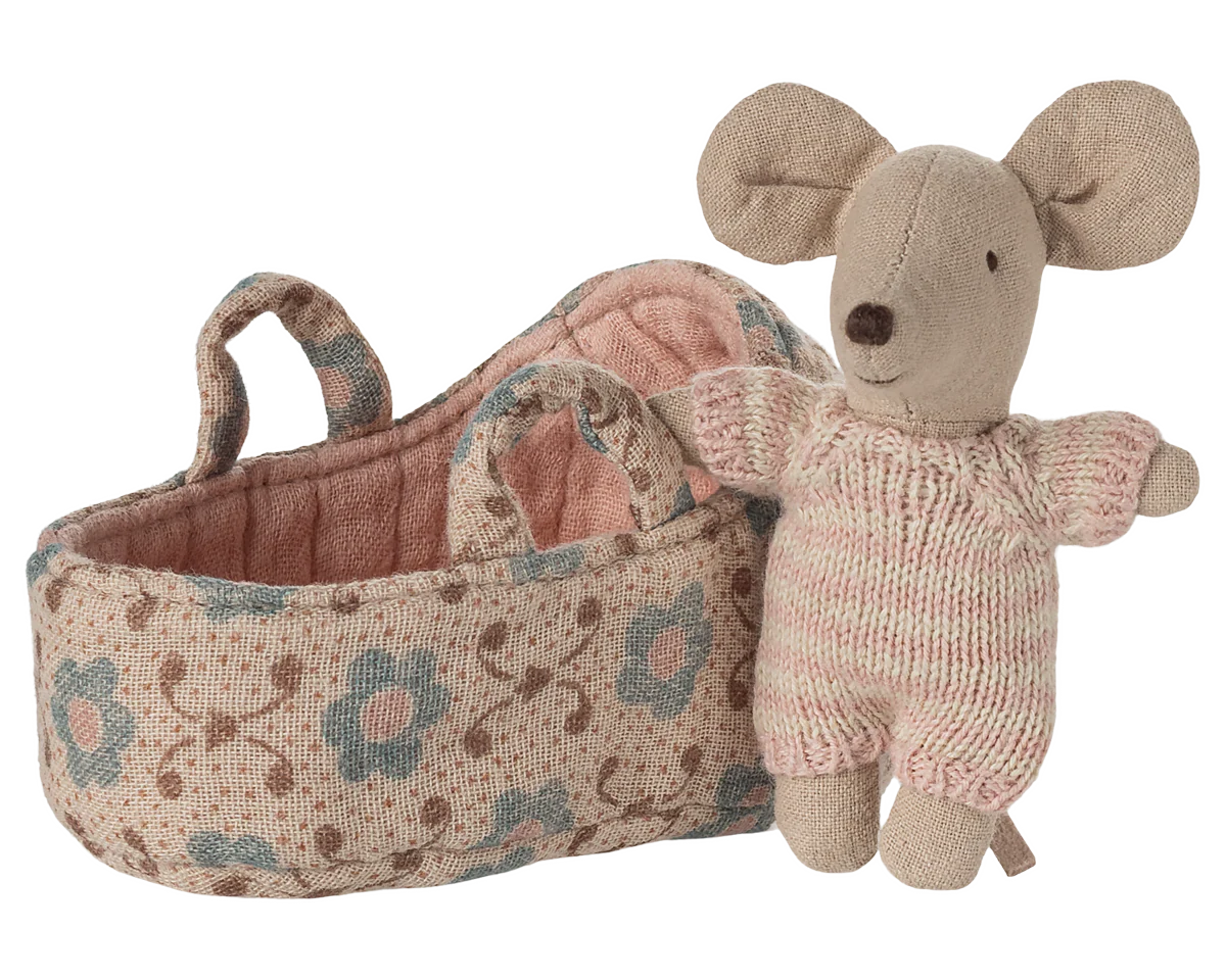 Knitted mouse toy with floral-patterned basket on a white background