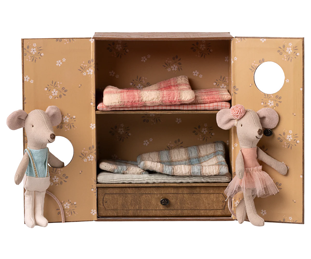 Two toy mice in a decorative box with folded fabric and a drawer. | mAILEG uk