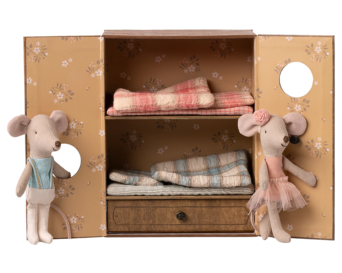 Two toy mice in a decorative box with folded fabric and a drawer. | mAILEG uk