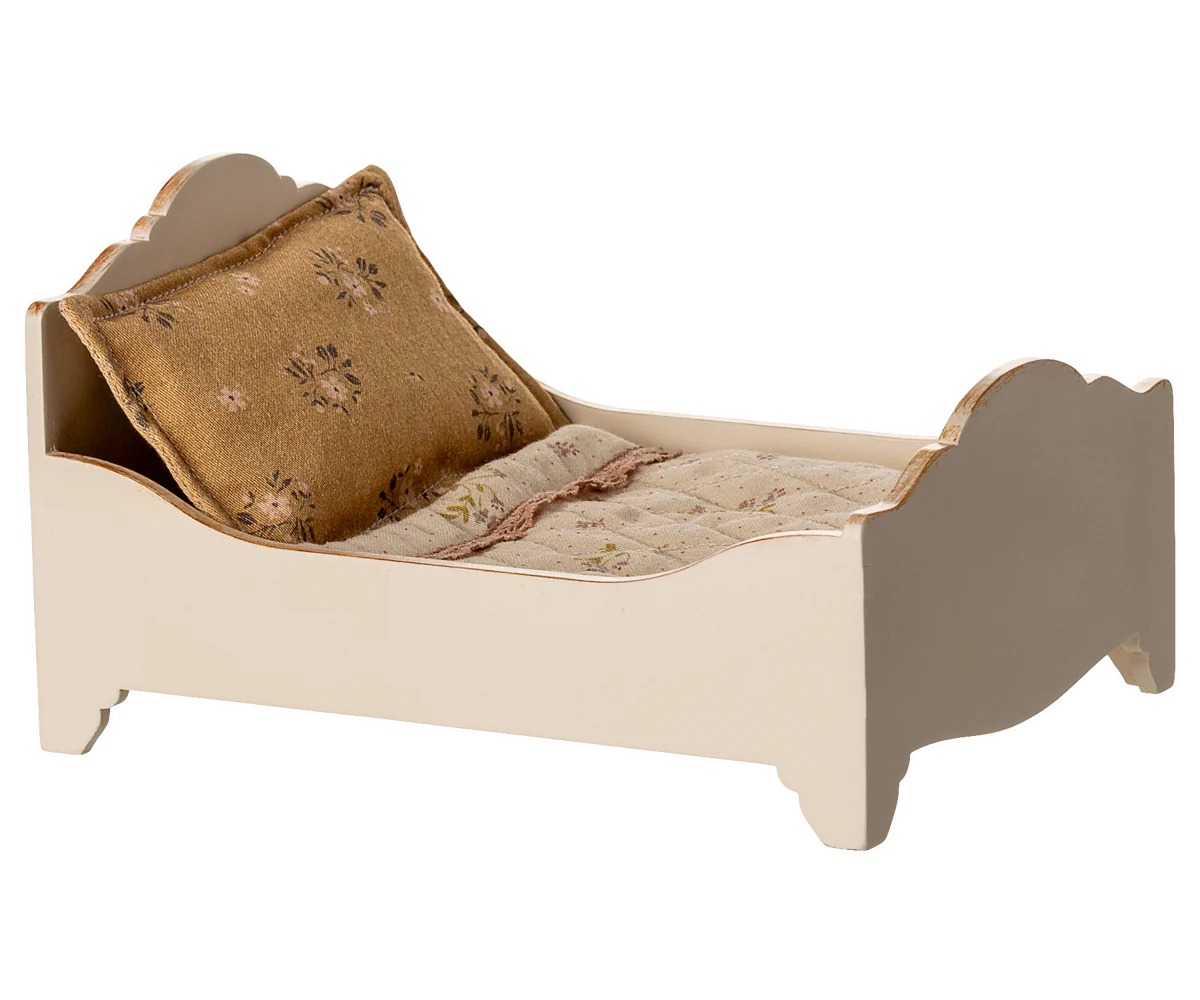 Small bed with a pillow and blanket on a white background | Maileg UK