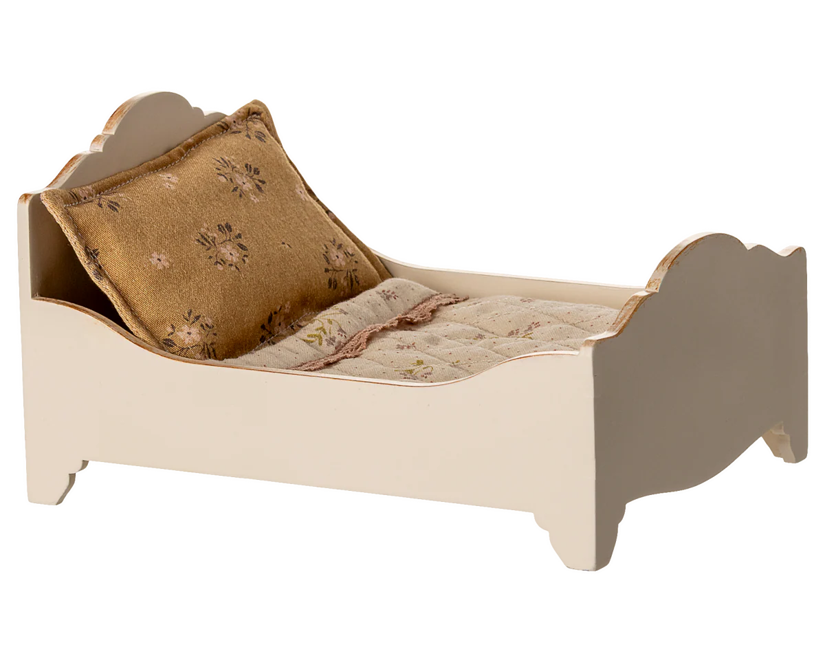 Small bed with a pillow and blanket on a white background | Maileg UK
