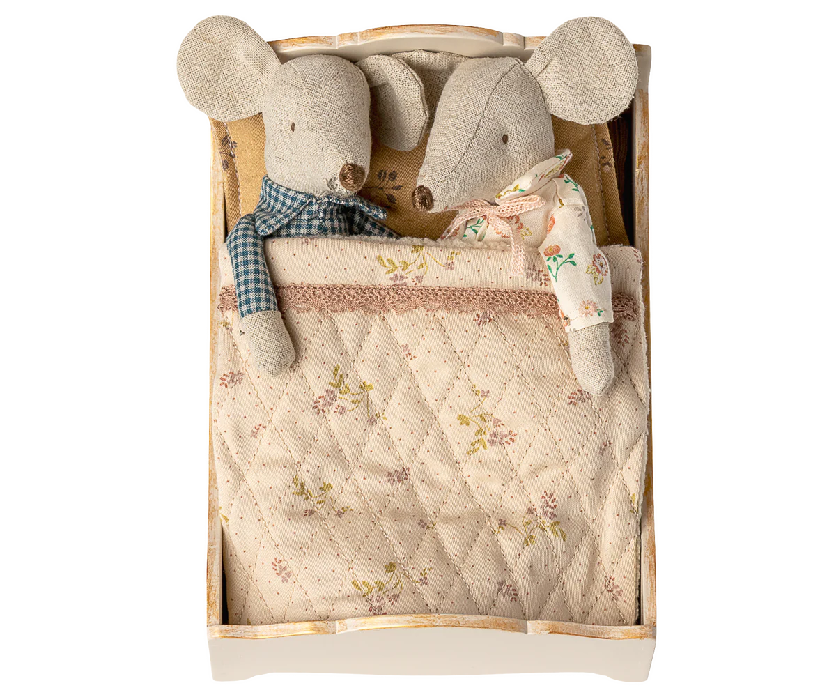 Two plush mouse toys in a wooden box with a quilted blanket | Maileg UK