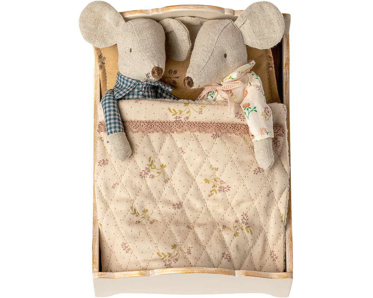 Two plush mouse toys in a wooden box with a quilted blanket | Maileg UK