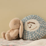 Plush toy and checkered pillow with embroidered design on a neutral background | Maileg UK