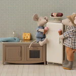 Two toy mice in a kitchen setting with a refrigerator and sink. | Maileg UK