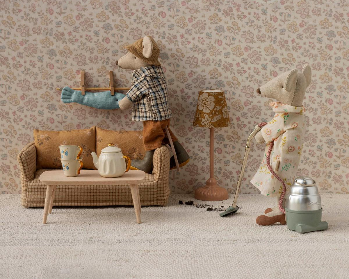 Two toy mice in a room with furniture and decor, including a lamp and a teapot. | Maileg UK