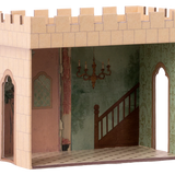 Wooden dollhouse with castle design featuring a staircase and chandelier. | Maileg UK