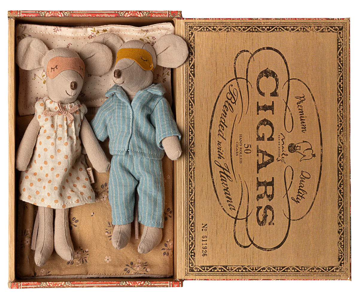 Two toy mice, a girl in a dress and a boy in overalls, inside an open cigar box with decorative text. | Maileg UK