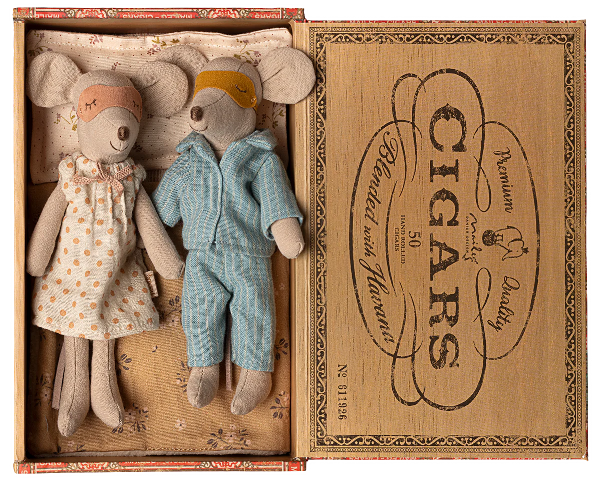 Two toy mice, a girl in a dress and a boy in overalls, inside an open cigar box with decorative text. | Maileg UK