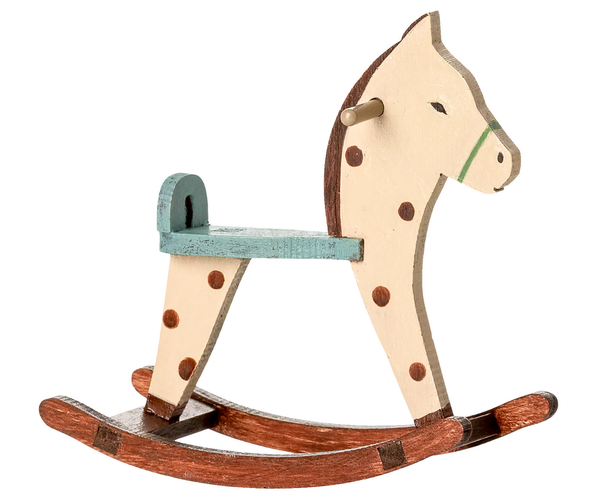 Wooden rocking horse with a white face, brown spots, and a green mane on a white background. | Maileg UK