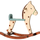 Wooden rocking horse with a white face, brown spots, and a green mane on a white background. | Maileg UK