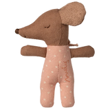 Brown plush toy with a pink outfit on a white background