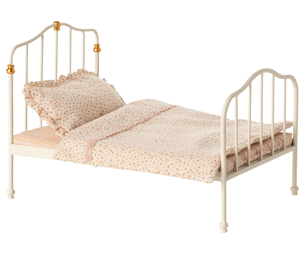 Small bed with white metal frame and pink bedding on a white background | Maileg UK