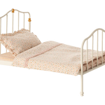 Small bed with white metal frame and pink bedding on a white background | Maileg UK