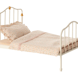 Small bed with white metal frame and pink bedding on a white background | Maileg UK