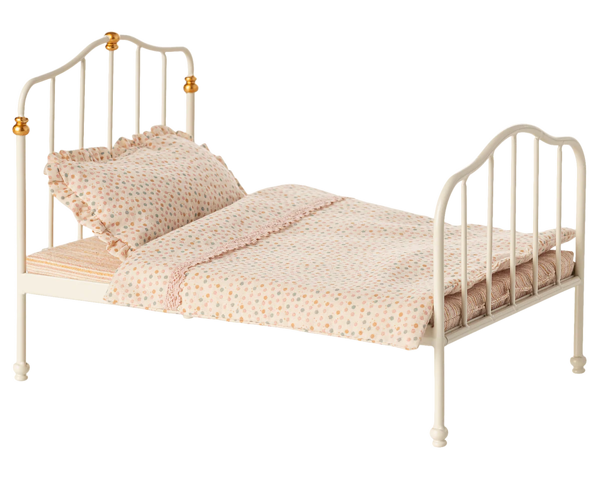 Small bed with white metal frame and pink bedding on a white background | Maileg UK