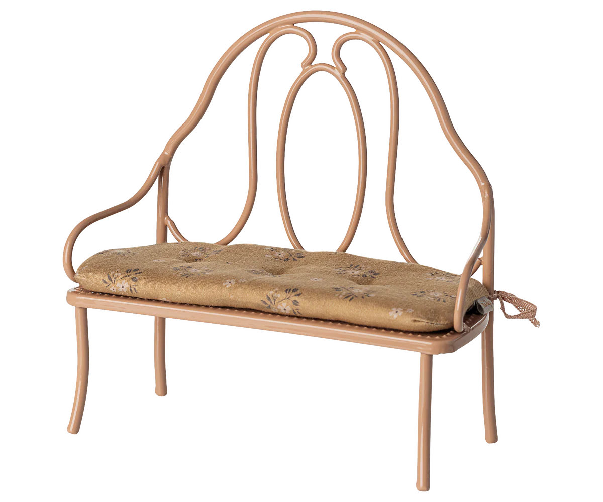 Wrought iron bench with a cushion on a white background | Maileg UK