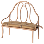 Wrought iron bench with a cushion on a white background | Maileg UK