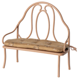 Wrought iron bench with a cushion on a white background | Maileg UK