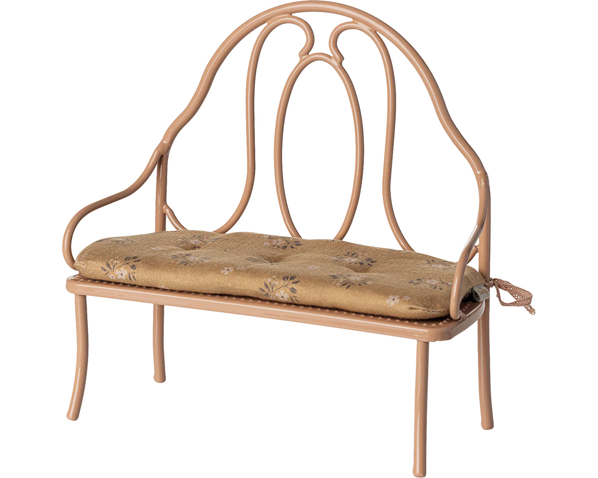 Wrought iron bench with a cushion on a white background | Maileg UK