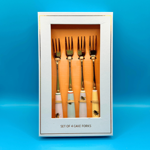 Set of 4 golden cake forks in a gift box with colourful yvonne ellen bee design on the handles. Making your next tea party extra special 