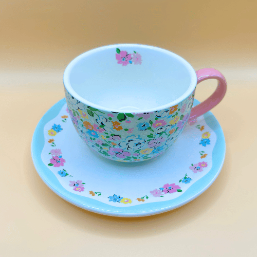 Stoneware cup and saucer with a pink handle and classic cath kidston floral pattern bright and cheery crockery