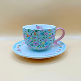 Floral cath kidston mug and saucer with a pink handle and a vintage bright and happy style. The perfect gift