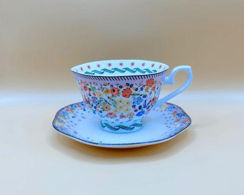 cath kidston bone china cup and saucer kitsch design with flowers and intricate detailing. english tea never tasted so good