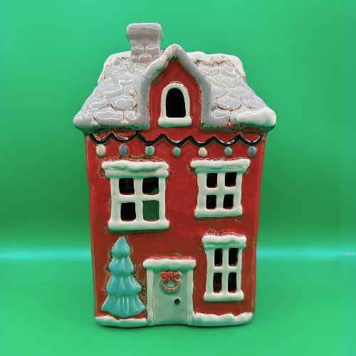 Christmas Ceramic Tea Light Candle House, red with tiled snowy roof, christmas lights, a tree by the front door with wreath. | Christmas Decor