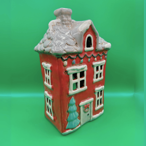 Christmas Ceramic Tea Light Candle House, red with tiled snowy roof, christmas lights, a tree by the front door with wreath. | Christmas Decor