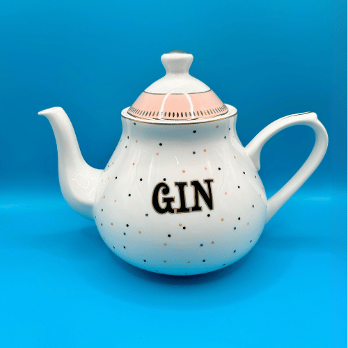 bone china yvonne ellen boozy tea pot with gin written on it and a polka dot design and pink detail on the lid. a fun and beautiful gift for your next tea party