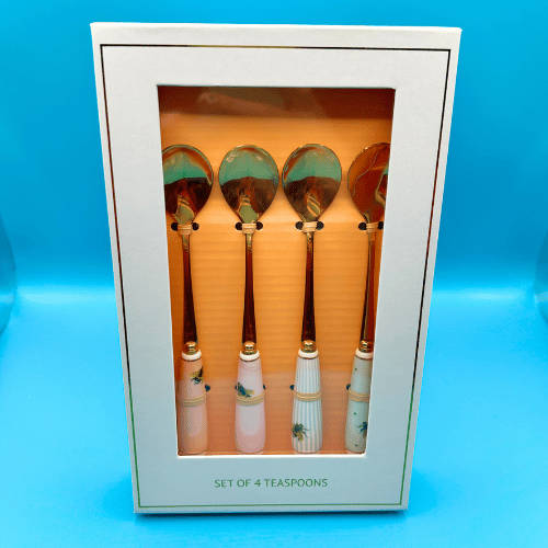 golden metal spoons set of 4 in gift box with handles decorated in a beautiful contemporary yvonne ellen bee design. Perfect accessories for a tea party celebration or a really posh way to eat your ice cream!